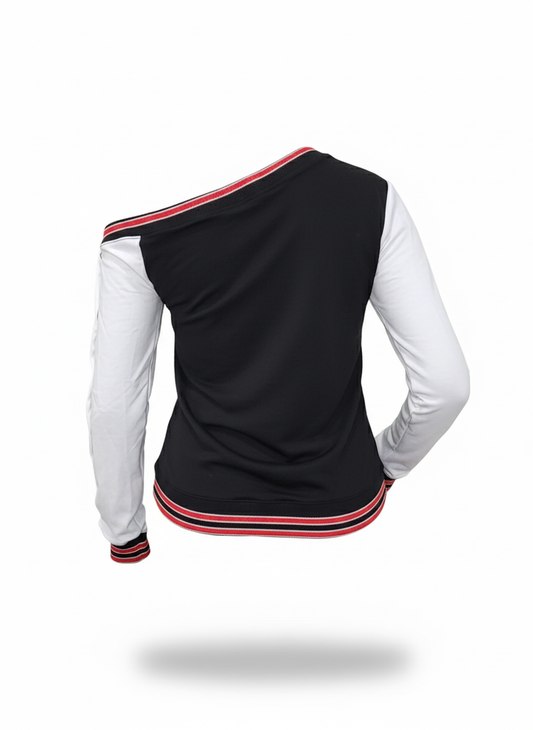 Black and white long-sleeve top with red accents on a white background